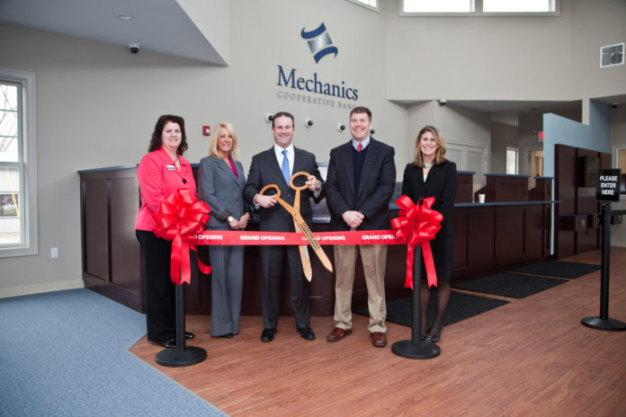 MECHANICS COOPERATIVE BANK has opened a new branch in Taunton, relocating from an existing branch in the city. Attending a ribbon-cutting ceremony on Feb. 28 were, from left, Branch Manager Cheryl Monteiro, Executive Vice President Deborah Grimes, President and CEO Joseph T. Baptista Jr., Taunton Mayor Tom Hoye and Taunton Area Chamber of Commerce President Kerrie Babbin. / COURTESY MECHANICS COOPERATIVE BANK