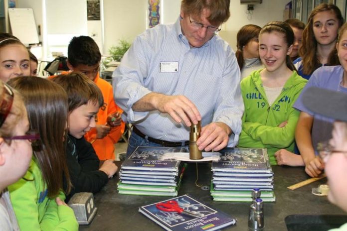 FROM THE STEM: Curtis Johnson of EMC visits the Douglas Intermediate School in Douglas, Mass., to speak about his work. He volunteered through DIGITS, a Massachusetts education program. / COURTESY DIGITS