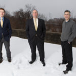 ECONOMIC ENGINE: From left, Pawtucket Foundation Executive Director Aaron Hertzberg, Pawtucket Mayor Donald R. Grebien and city Planning Director Barney Heath at a 7.4-acre Division Street lot targeted for redevelopment. / PBN PHOTO/RUPERT WHITELEY