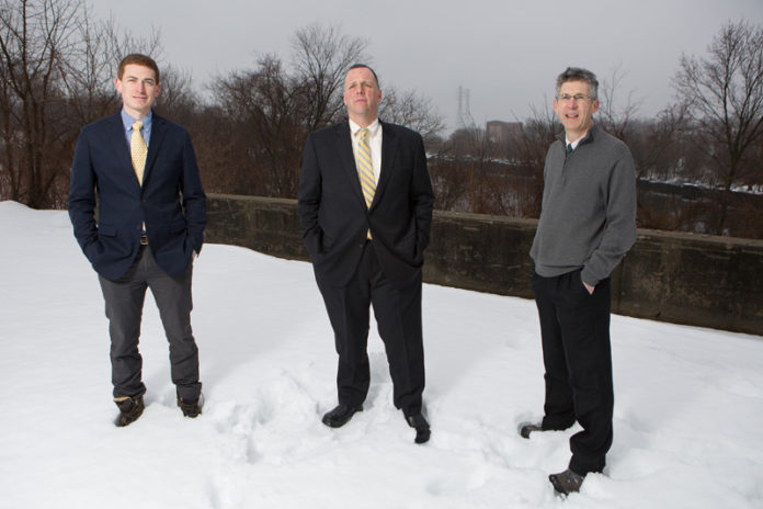 ECONOMIC ENGINE: From left, Pawtucket Foundation Executive Director Aaron Hertzberg, Pawtucket Mayor Donald R. Grebien and city Planning Director Barney Heath at a 7.4-acre Division Street lot targeted for redevelopment. / PBN PHOTO/RUPERT WHITELEY