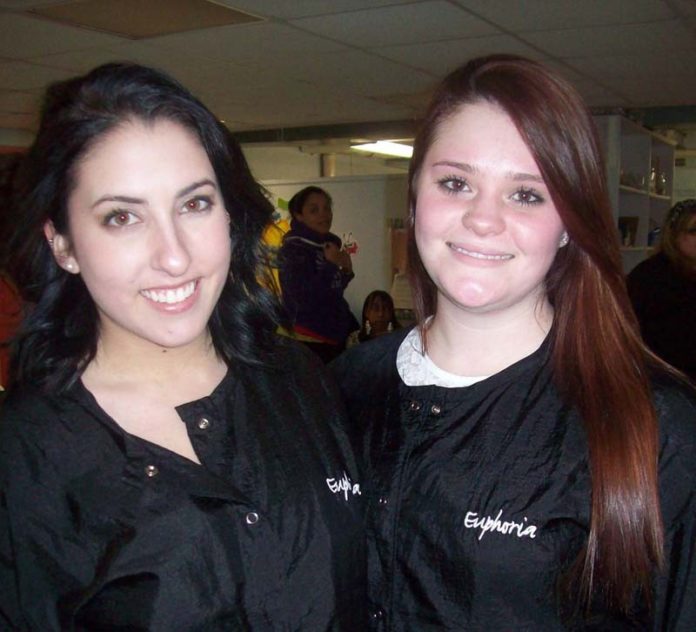 MONICA CABRERA, left, of East Greenwich, and Makayla Yuro, of East Providence, were among the 10 students and instructors from Euphoria Institute of Beauty Arts and Sciences who donated their time to treat more than a dozen single mothers at McAuley Village.