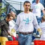Time off to volunteer gains steam CONNECTING WITH COMMUNITY: Volunteers from Blue Cross & Blue Shield of Rhode Island help the Thundermist Health Center in West Warwick build a garden. / COURTESY DT PHOTOGRAPHY/BLUE CROSS & BLUE SHIELD OF RHODE ISLAND