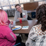 Passion there but economy squeezes ability to give NO SUBSTITUTE FOR TIME: Gail Gavin is given about 90 minutes each week from Citizens Bank to volunteer as a mentor at Winman Junior High School in Warwick, helping students with anything from homework to clothes choices. / PBN PHOTO/MICHAEL SALERNO
