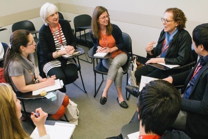 IN BLOOM: Participants at the SEEED Summit at Brown University in 2013 share best practices and information on trends in social enterprise. / COURTESY PAINTED FOOT PHOTOGRAPHY/CAT LAINE