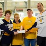 Granite gives $4,322 to scholarship fund THE HOPKINS family accepts a contribution from Mark Palmer of Granite Telecommunications on March 29 at the June Rockwell Levy Arena in Burrillville. / COURTESY GRANITE TELECOMMUNICATIONS LLC