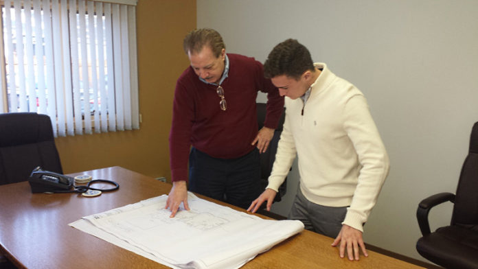 DURING HIS EXTERNSHIP, RWU student Joe Batista, right, was able to accompany Ernie Nadeau, Nadeau Corp. CEO, to meetings with colleagues, clients and subcontractors and visit the company’s project sites.