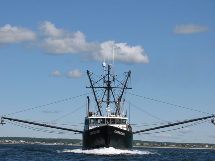 TO THE POINT: Point Judith fishing boat Karen Elizabeth steams out of Galilee on its way to the squid fishing grounds. / PBN PHOTO/JOHN P. LEE