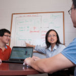 STAR SYSTEM: URI professor Yan Lindsay Sun, center, has developed a prototype software to identify suspicious online reviews. At left in photo is Yihai Zhu and at right Yongbo Zeng, both URI Ph.D. candidates. / PBN PHOTO/MICHAEL SALERNO
