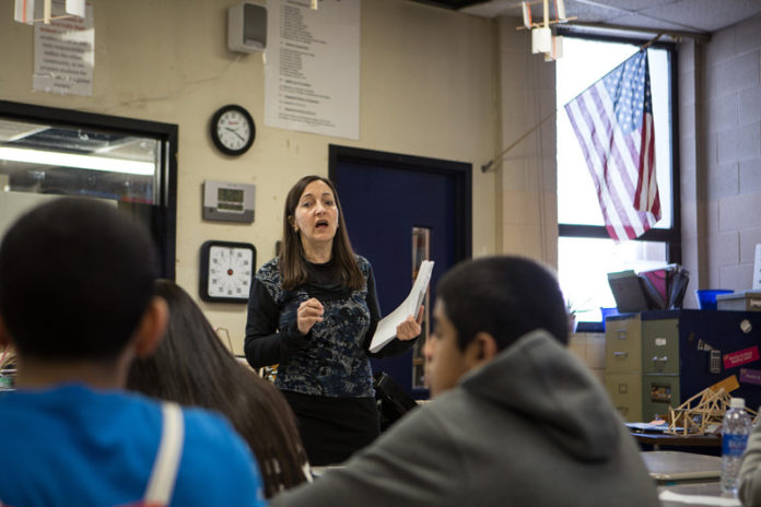 LANGUAGE SCIENCE: Central Falls High School physics teacher Alison Murray has begun correcting her students’ English mistakes. “I’m more in tune to how critical it is. And it’s making me more highly qualified as a teacher.” / PBN PHOTO/RUPERT WHITELEY