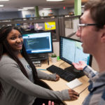 New name, focus for JWU’s tech school NEW SCHOOL APPROACH: Web designer Maya Johnson with Astonish co-worker Ryan Kanner. Johnson, 24, of Providence, earned a degree from JWU last year in graphic design and digital media. / PBN PHOTO/MICHAEL SALERNO