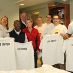 VOLUNTEERS FROM UPS and United Way of Rhode Island gather after helping organize a sewing room used by House of Hope Community Development Corporation for their supported employment program, House of Hope Boutique. / COURTESY UNITED WAY