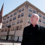 City weighs tax-incentive changes STABLE ENVIRONMENT? Steve Durkee, principal at Cornish Associates, stands in front of the Kinsley Building on Westminster Street in Providence. Cornish Associates bought the Kinsley Building from Johnson & Wales University in 2012, but has been waiting for a decision on whether it will get a tax-stabilization deal before turning it into apartments. / PBN PHOTO/MICHAEL SALERNO