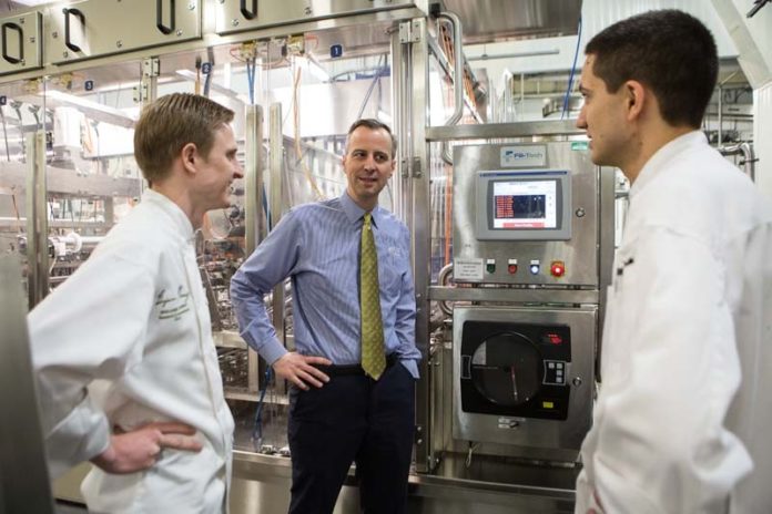 GROWING CAPABILITIES: Todd Blount, center, president of Blount Fine Foods since 2000, has invested heavily in the food manufacturer’s ability to adapt to the fast-changing consumer food marketplace, including by supporting fast product development by the company’s research and development team, including R&D chefs Benjamin Murray, left, and Thomas Gervasi. / PBN PHOTO/RUPERT WHITELEY