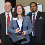 2014 Manufacturing Award Photos Paula Christina, Ametek SCP accepts the Excellence in Global Exporting Award from Roger Bergenheim, PBN and Harsha Prakash, Polaris MEP / Rupert Whiteley