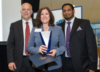 Paula Christina, Ametek SCP accepts the Excellence in Global Exporting Award from Roger Bergenheim, PBN and Harsha Prakash, Polaris MEP / Rupert Whiteley