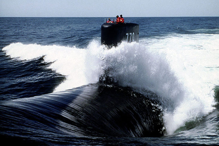 GOING UNDER: Electric Boat plans to hire about 650 workers in North Kingstown to the 2,800 already employed there to handle the expected work for a new contract on Virginia-class submarines similar to the one pictured above. / BLOOMBERG FILE PHOTO