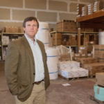 Emphasizing local advantages SUPPLY AND DEMAND: Erik Warner, president of TJ Russell Supply, took the reins at the company in the late 1980s. The company focuses on value, offering a rewards program for its customers. / PBN FILE PHOTO/TRACY JENKINS