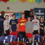 North Attleboro kids <Br>
raise funds, meet Patriots TWO NEW ENGLAND PATRIOTS players, cornerback Kyle Arrington, left, and wide receiver Matthew Slater, sixth from left, greet this year's top six fund-raising players from North Attleboro Middle School, which raised more than $95,000 in an American Heart Association fund raiser. / COURTESY PATRICIA HITCHCOCK