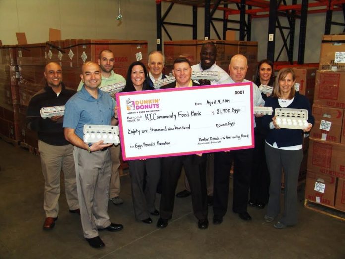 DUNKIN’ DONUTS employees and franchise owners, along with representatives from Moark Eggs and the Rhode Island Community Food Bank, gather to celebrate the egg donations to Feeding America.