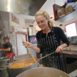 Restaurant group built on her pledge to stay fresh FULL PLATE: Jessica Silver Wood, co-owner of Fire & Water Restaurant Group, in the kitchen at Caliente Mexican Grill in the Kingston Emporium. / PBN PHOTO/BRIAN MCDONALD