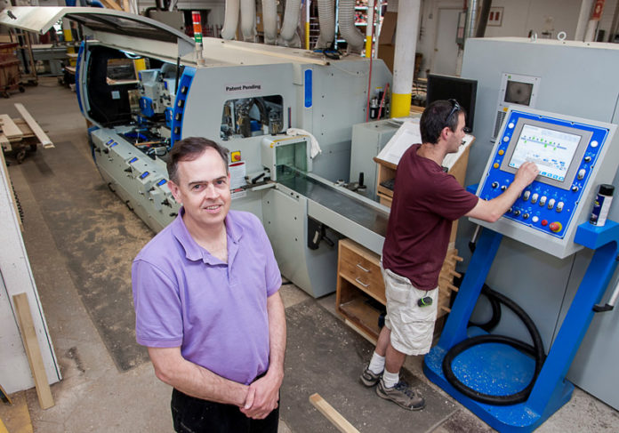 BREAKING THE MOLD: When President Ken Bertram, above left, and partners took over Cumberland’s Herrick & White Architectural Woodworkers in 2007, a single commercial customer accounted for much of the company’s business. But the Great Recession forced a change in strategy. Also pictured is moulder operator Steve Langis. / PBN FILE PHOTO/MICHAEL SALERNO