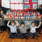 WashTrust collects five tons of peanut butter for food banks WASHINGTON TRUST'S 14th annual peanut butter drive collected more than five tons of peanut butter from 15 businesses and 16 schools across the state for local food pantries. Above, students at Saint Paul School in Cranston pose with their collections. / COURTESY SAINT PAUL SCHOOL