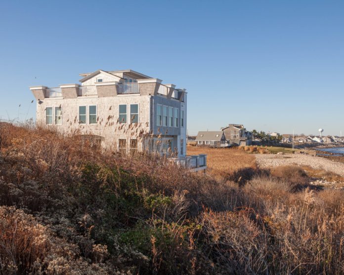 AN R.I. SUPREME COURT judge has ruled that Robert Lamoureux's $1.8 million Ocean Road house, mistakenly built on Point Judith park land after a poor survey, must be torn down. / PBN PHOTO/TRACY JENKINS