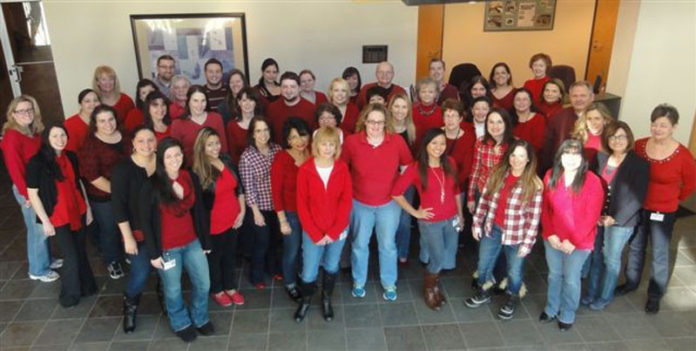 HAVE SOME HEART: Pawtucket Credit Union was one of a number of Rhode Island companies that showed support for workers’ heart health by participating in the 2014 Go Red for Women Day. / COURTESY PAWTUCKET CREDIT UNION