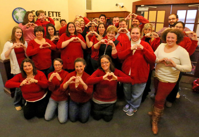 PUTTING THEIR HEART INTO IT: Collette employees donated more than $1,000 to the American Heart Association in February, allowing them to wear jeans and red to work as part of the company’s Month of Action. / COURTESY COLLETTE
