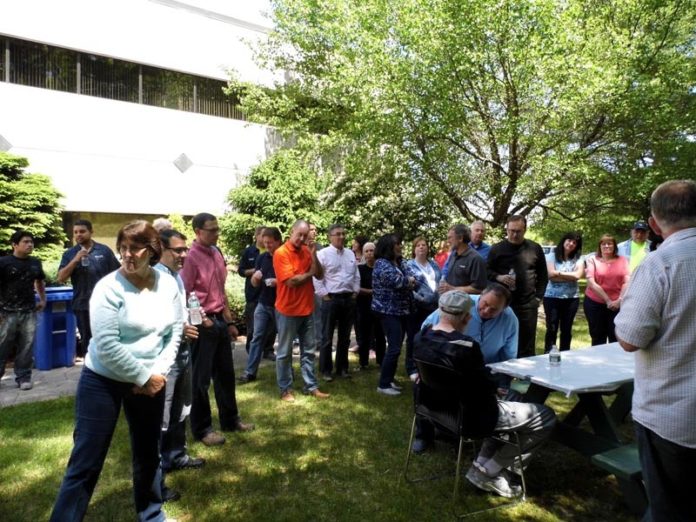 TAKING CARE OF ITS OWN: Dryvit Systems celebrated the retirement of two long-time employees in May, sending them off with both a pension and a 401(k). / COURTESY DRYVIT