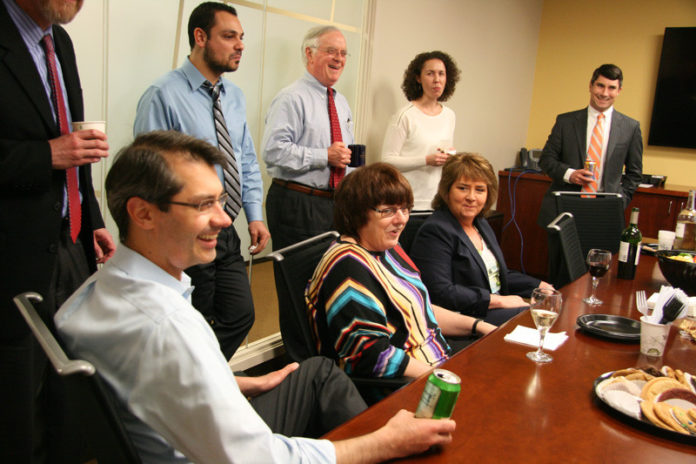 PEER REVIEWED: The staff members at Robinson & Cole are encouraged to attend events and interact with employees. Aside from boosting morale, it also allows the company to provide a more “personal level” of services, said Regional Business Development and Marketing Manager Nicole Babine Campbell. / PBN PHOTO/MICHAEL PERRSON