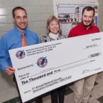 JONATHAN CANINO (right) who captured first place in a national competition for his talk titled "Safe Training Aids for Bomb-Sniffing Dogs," poses with the winning check beside University of Rhode Island chemistry professor Jimmie Oxley (center) and Even Bernier (left), a former graduate student of Oxley's. / COURTESY UNIVERSITY OF RHODE ISLAND/MICHAEL SALERNO