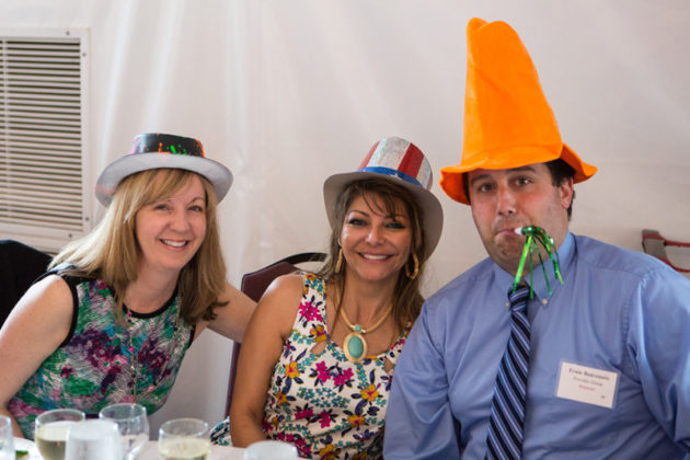 Provider Group's employees decked out with hats and noisemakers / Rupert Whiteley