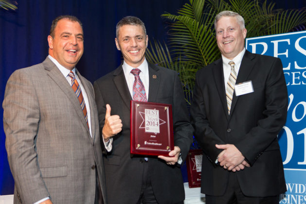 Tim Hebert, CEO of Atrion accepts the award for the No. 1 spot in the Large Company category / Rupert Whiteley