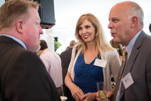 Ross Nelson and Suzanne Elsbecker, Cox Business with Roger Bergenheim, PBN President and Publisher (right)  / Rupert Whiteley