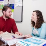 CAPITAL PLAN: Capital Good Fund Founder and Executive Director Andy Posner and Libby Kimzey, senior vice president of coaching and systems,  working together. / PBN PHOTO/MICHAEL SALERNO