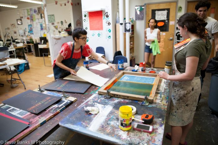 STUDENTS USE the screen-printing facilities at New Urban Arts.