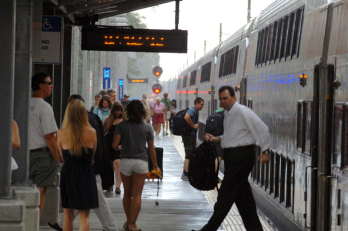 PASSENGERS DISEMBARK from a commuter rail train at Wickford Junction in July 2012. Fares for all commuter rail passengers will increase Tuesday as the Massachusetts Bay Transportation Authority instituted its new public transportation rates. / PBN FILE PHOTO/BRIAN MCDONALD