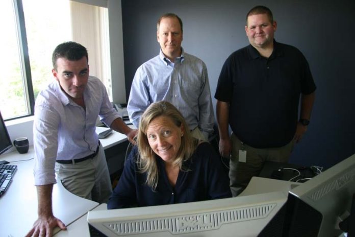 GETTING THE PICTURE: Middletown-based Vizsafe offers an app that allows smartphone users to upload photos and videos that could aid public safety efforts. Pictured above, from left, are Vizsafe employees Brendan Hanna, Debbie Lipsett, President and CEO Peter Mottur and Patrick Hay. / PBN FILE PHOTO/MICHAEL PERRSON