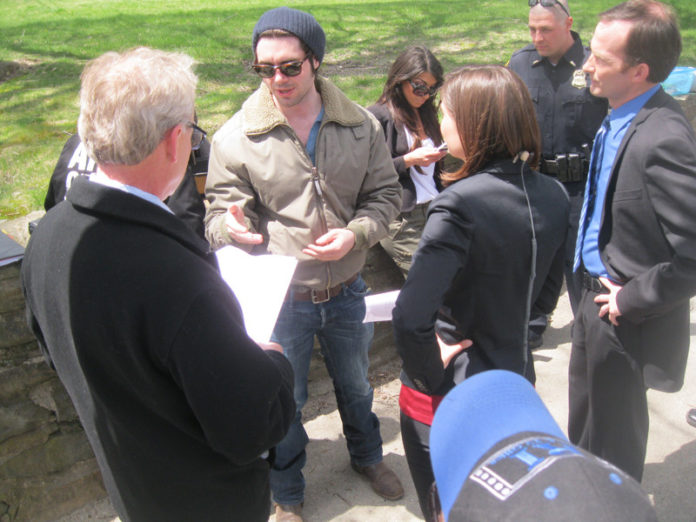 LEADING MAN: “Almost Mercy” director Tom DeNucci, above wearing sunglasses, gives instructions to actors on set. / COURTESY R.I. FILM & TELEVISION OFFICE