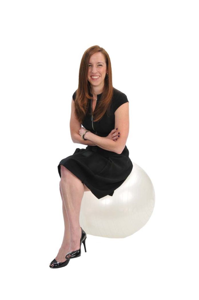 THE PROP: Angela Carr uses an exercise ball – along with other fitness equipment – to maintain balance in her life.