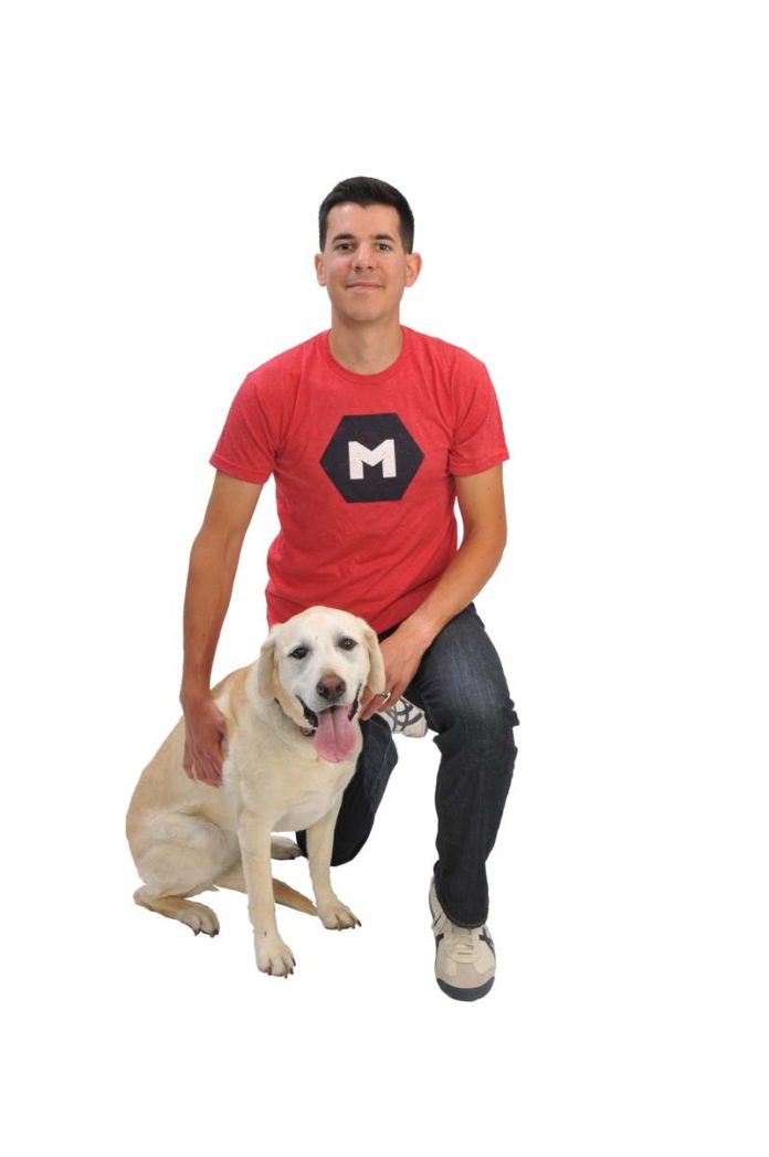 THE PROP: Emma, an 11-year-old Yellow Lab, was Nick Kishfy’s first “employee at MojoTech, and she still comes to the office along with a few other dogs, he says.