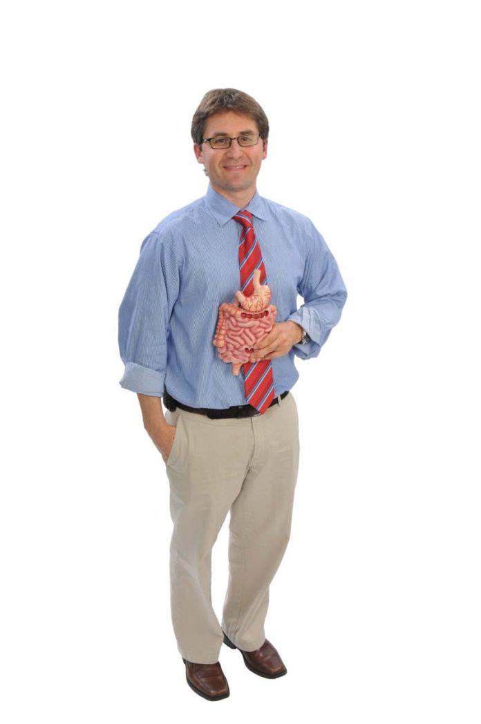 THE PROP: Dr. Adam Harris takes his professional responsibilities as a gastroenterologist seriously, but he also derives great satisfaction from them.