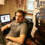 38 Studios staff slowly scattering EXTRA LIFE: Former 38 Studios artist Joe Mirabello sits at his work station in Sharon, Mass., where he designed his own game, “Tower of Guns.” Mirabello spent almost two years after the close of 38 Studios programming and designing the game. / PBN PHOTO/MICHAEL PERRSON