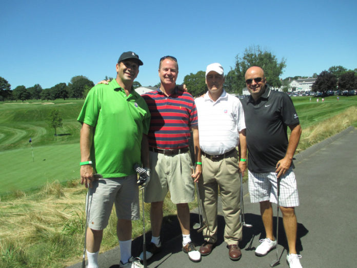 FROM LEFT: Stu Berg, Allen H. Chatterton III, Ned Concoran and Peter Carvalhalo pose during last year’s tournament at the Wannamoisett Country Club.