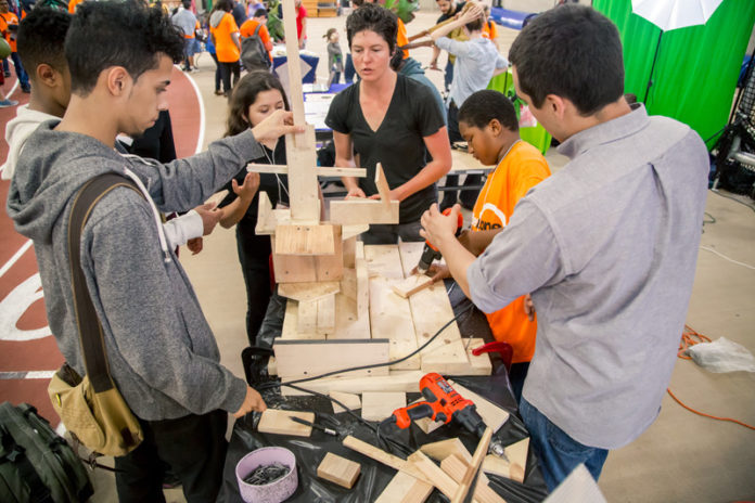 IN THE ZONE: Employees from AfterZone program provider DownCity Design demonstrate hands-on engineering at the Providence Career and Technical Academy on June 5. / COURTESY CHERYL ADAMS-JOHNSON PHOTOGRAPHY