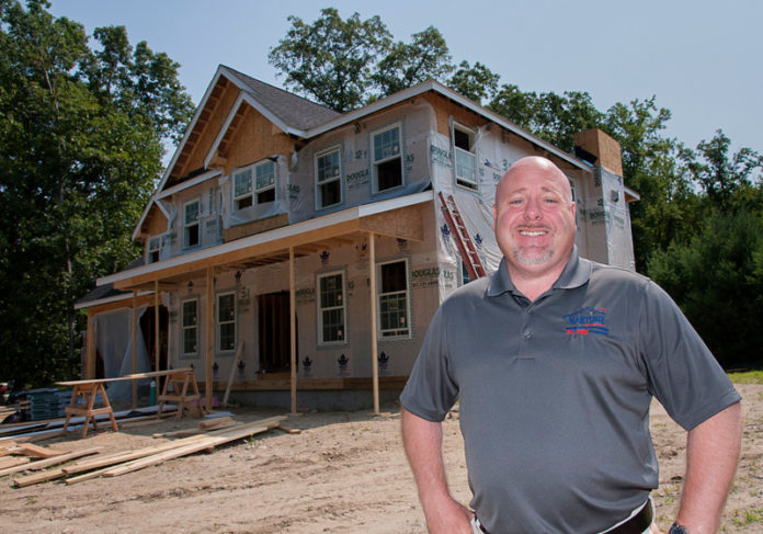 CONSTRUCTION EMPLOYMENT in Rhode Island grew 4.3 percent in July compared with a year earlier for a total of 16,800 jobs, the Associated General Contractors of America reported Monday. Above, Karl Martone, a broker associate with Re/Max Properties in Smithfield, at the contrtuction site of a new home in Lincoln. / PBN FILE PHOTO/MICHAEL SALERNO