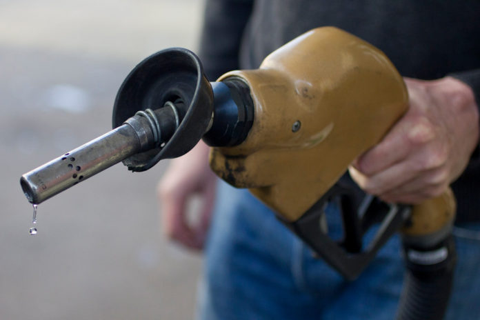 GAS PRICES DROPPED in Rhode Island and Massachusetts, according to AAA Southern New England's weekly survey. / BLOOMBERG FILE PHOTO/ANDREW HARRER