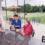 ON PAR: While the recession took its toll on the local golf-club industry, most locations have been able to rebound in recent years. Above, Sue Pimental, general manager and managing partner of the Hillside Country Club, speaks with patrons Paul  Harris, left, and Richard Haley. / PBN PHOTO/MICHAEL SALERNO
