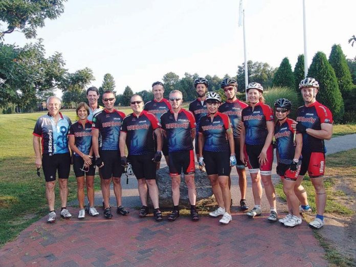 MEMBERS OF LifeCycle’s Peloton Pack pose for a photo before the 75-mile course began. Peloton Pack members who rode the 25-mile course are not pictured. Pictured from left: George Dys, Judi Donnelly, Kevin Donnelly, Scott Martin, David Carroll, Benjamin Hartley, Dean Pendelton, Craig Jolicoeur, Paula Raposo, Michael Silva, Karen Antons, Dani Brier and Jacob Brier.